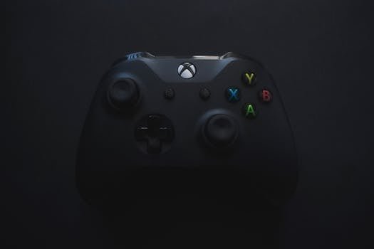 Xbox controller illuminated against a dark background, perfect for gaming themes.